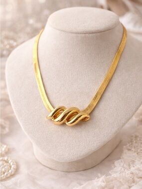 Vintage Gold Tone Herringbone Necklace with Sculptural Swirl Centerpiece